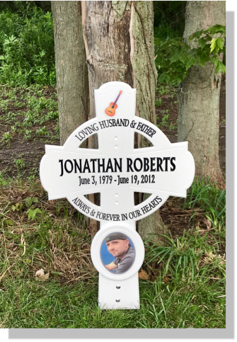 Road side memorial with guitar and picture